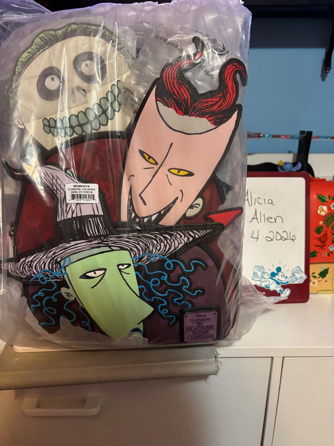 Customer photo review of Loungefly Disney Nightmare Before Christmas Glow in the Dark Lock, Shock, and Barrel Triple Pocket Mini Backpack - 707 Street Exclusive