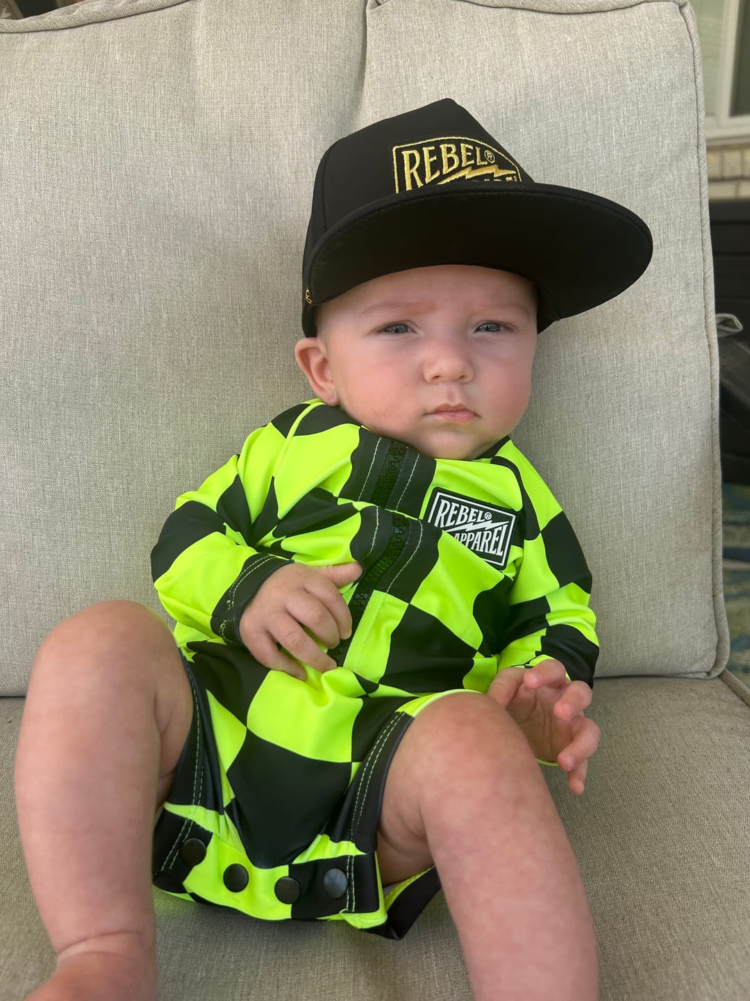 Customer photo review of UPF50+ Boys Swim Romper in Neon Electric Lime + Black Checkered
