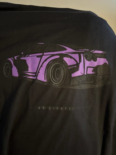Customer's close-up photo of the black 80Eighty DCG88 Shirt, showing the purple car graphic on the back.