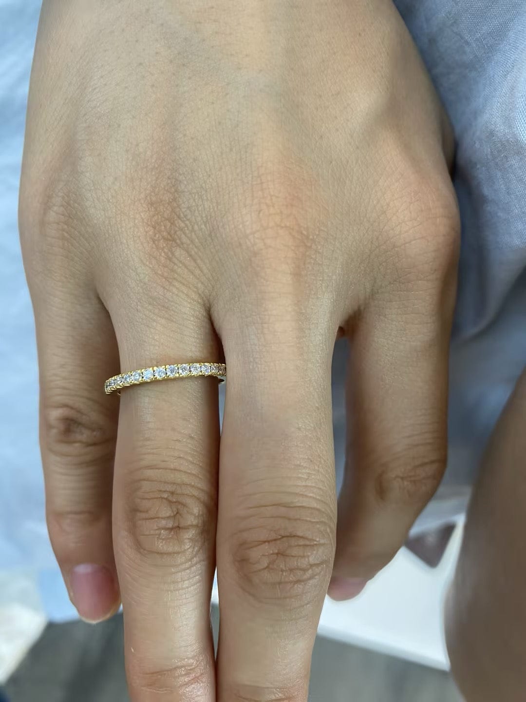 Customer photo review of Rodiffy Moissanite 0.5 Ct Round Cut Yellow Gold Anniversary Ring