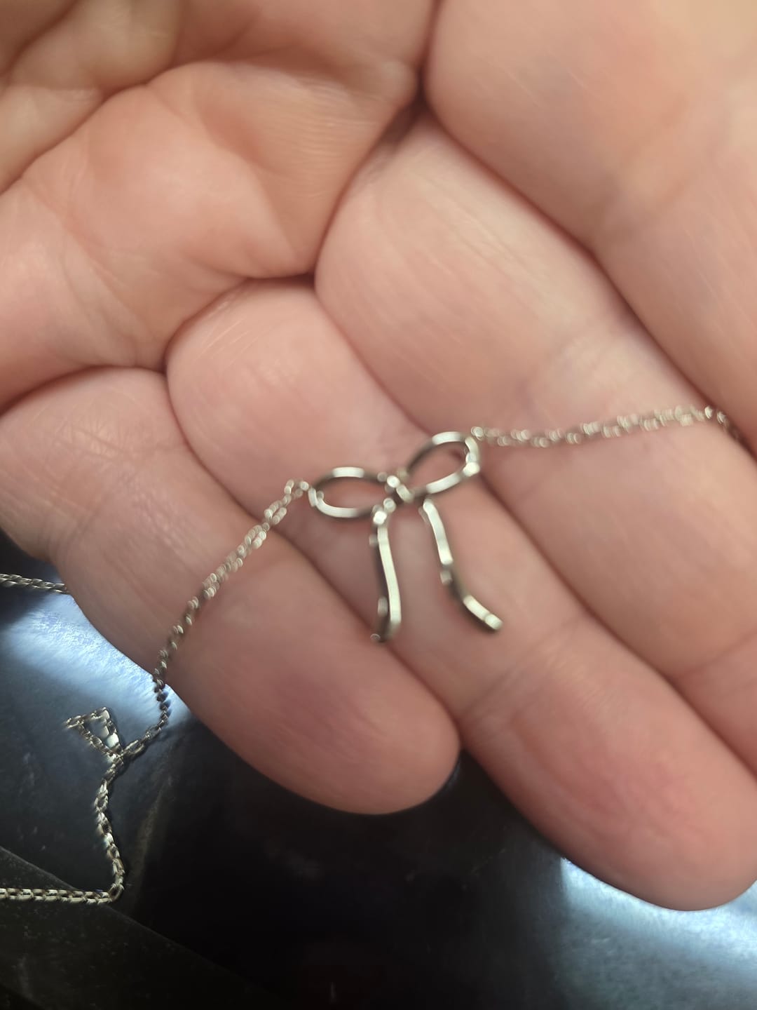 Customer photo review of Lola 18k White Gold Plated Ribbon/Bow Pendant Necklace