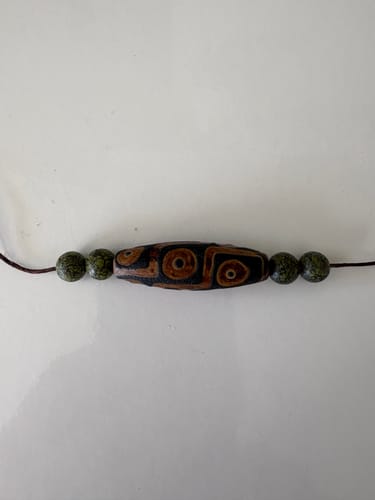 Customer photo review of Perle sacrée tibétaine Dzi ancienne à neuf yeux