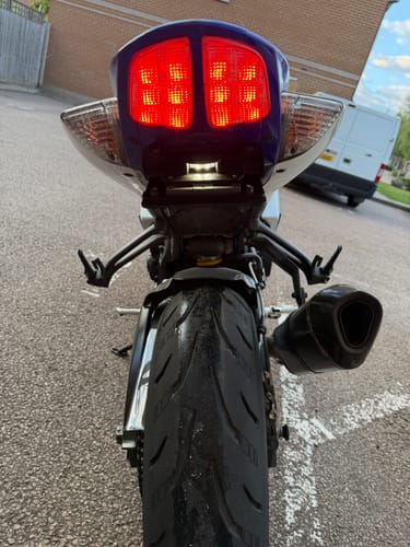 Customer's rear view of a Suzuki GSXR 750 showing the installed tail tidy and illuminated brake lights.