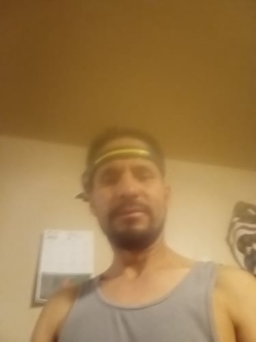 Partial view: A reviewer wearing the 80Eighty® HeadLamp on their forehead.