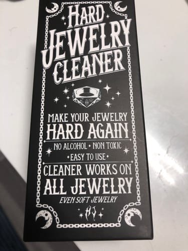 Packaging for the reviewer's JEWELRY CLEANING KIT, showing the black box with stylized white text.