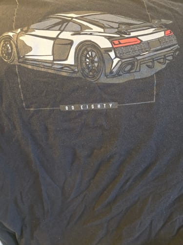 Close-up of the car graphic on a customer's black 80Eighty DCG89 Shirt.