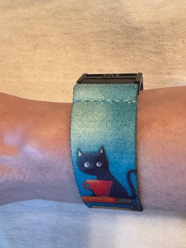 Customer wearing a cat-print watchband as a bracelet using the black Watchband+ bracelet adapters.