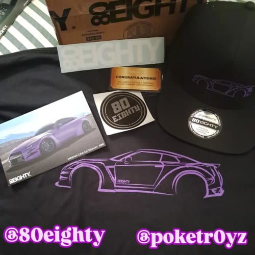 Customer's black 80Eighty hat with a purple car outline, shown with a t-shirt and stickers from the same order.