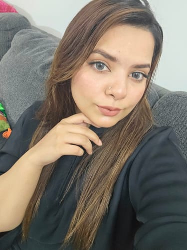 Reviewer in a selfie wearing the Innocent Smoke Grey Contact Lenses, showing a natural grey look.