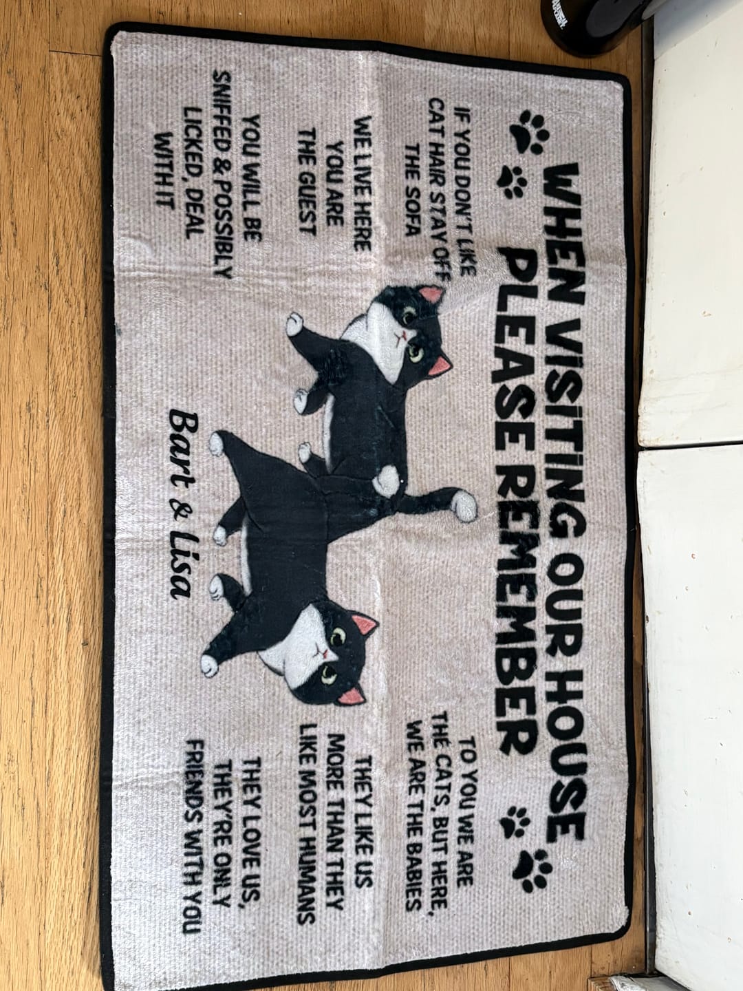 Customer photo review of Please Remember When Visiting Cats House Personalized Doormat