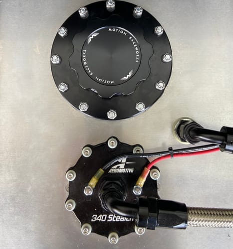 Customer's black Motion Billet Fuel Cap installed on their silver Aeromotive fuel cell.
