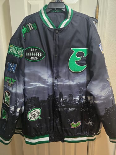 Reviewer's custom black varsity jacket with a Philadelphia cityscape graphic and multiple stitched patches.