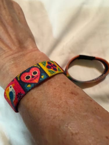 Customer wearing the colorful patterned 'Celebrate Life' bracelet from the Wonderful Life Pack on their wrist.
