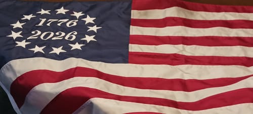 Customer's 1776 to 2026 Betsy Ross Flag laid out, showing a close-up of the embroidered dates and stars.