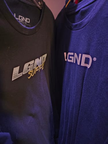 A customer's black and blue LGND t-shirts from the Mystery CASH Box hanging side-by-side.