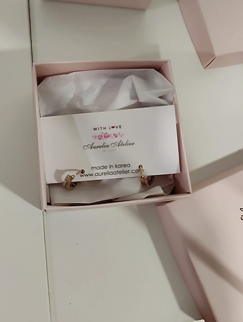 Customer photo review of Mia Huggie Hoop Earrings