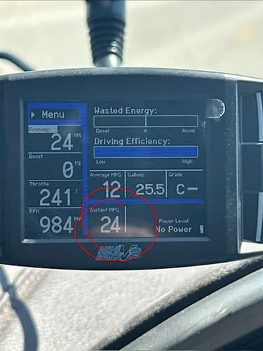 Customer's Mini Maxx Tuner V2 display showing an average MPG of 12 and an instant MPG reading of 24.