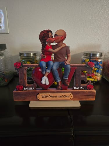 Customer's personalized wooden LOVE plaque with a cartoon couple kissing on top, customized with the names Pamela and Dajuan.