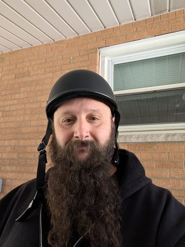 Reviewer wearing the black Switchback DOT Reversible Helmet in a forward-facing style.