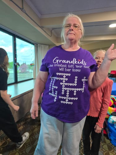 Customer wearing the purple personalized crossword puzzle shirt.