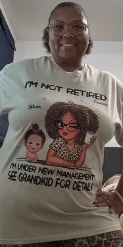 A reviewer models her personalized 'Professional Grandma' shirt with custom avatars of herself and a grandchild.