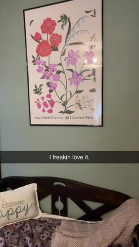 Customer's framed Custom Family Birth Flower Bouquet Artwork hanging on a wall.