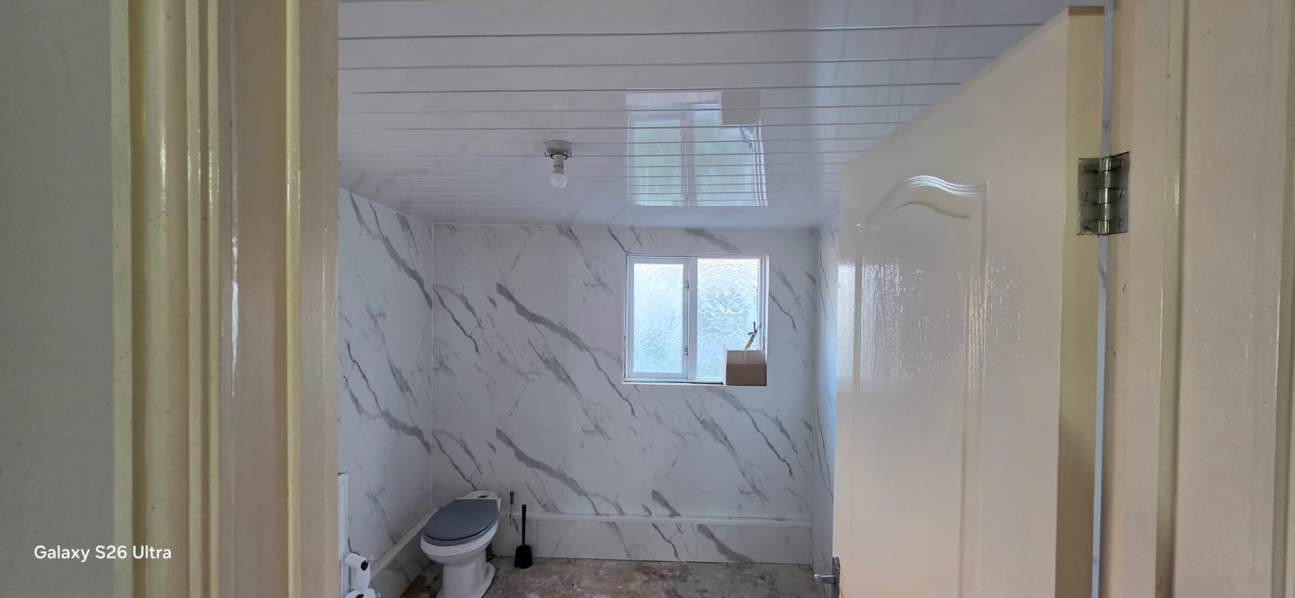Customer photo review of 8mm White Gloss With 2 Chrome Strip Wall & Ceiling Panel 2.6M