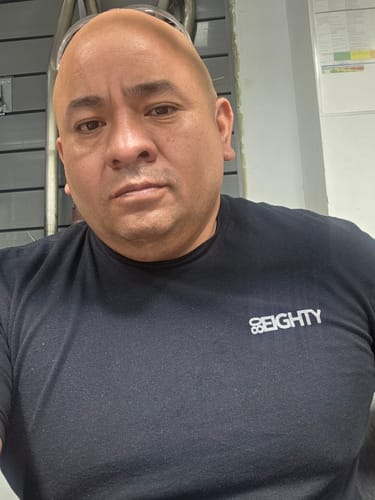 Customer wearing the black 80Eighty DCG88 shirt in a close-up photo.