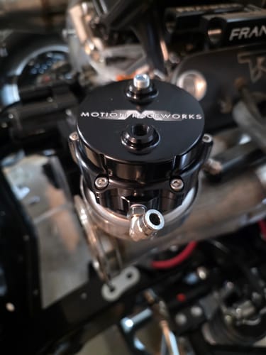 Customer's black Motion Raceworks blow off valve shown installed in an engine bay.
