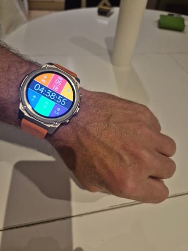 Customer showing the Gard Pro Ultra 3 watch on their wrist, featuring a colorful digital face and an orange strap.