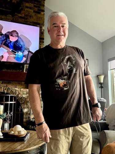 Customer wearing the dark Whiskey Black Lab Grunge T-Shirt, showing the graphic of a dog and a glass of whiskey.