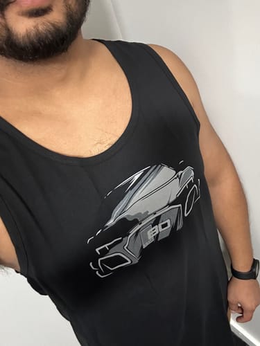 Customer wearing the black 80Eighty® Limited Edition DCG89 Tank, showing its comfortable fit and graphic car design.