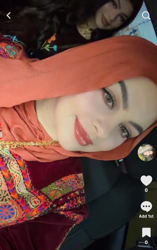 A close-up selfie of a reviewer wearing the beautiful Amber Premium Modal hijab.