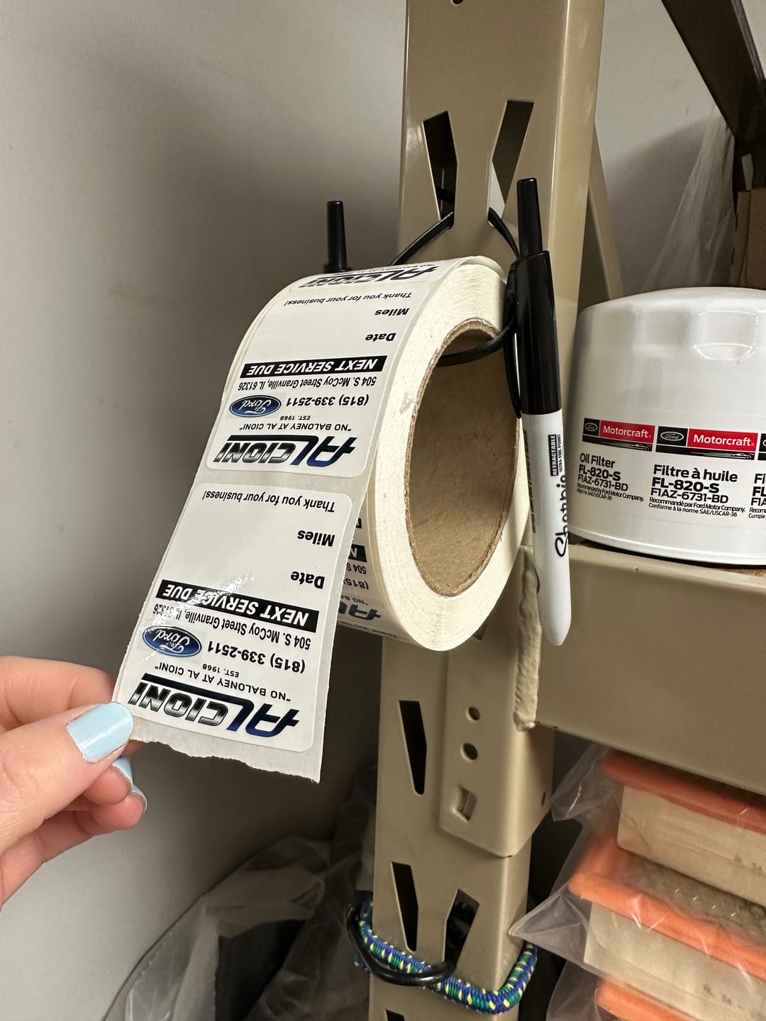 Customer photo review of Custom Oil Change Stickers for Windshield with Logo