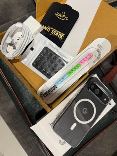 Customer's Anti Yellow Magsafe Clear Case on a phone, next to an open box with free accessories.