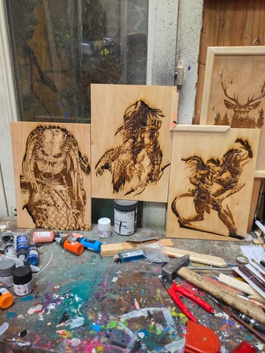 Customer displays detailed wood engravings of characters created with the AtomStack A70 Max laser cutter.