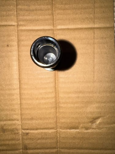 Customer showing the inside of the hollow AR-15 H3 Heavy Buffer on a cardboard surface.