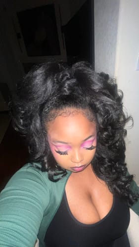 Reviewer from a high angle, showing the voluminous half up-half down style of the Sensationnel Instant Weave Half Wig.