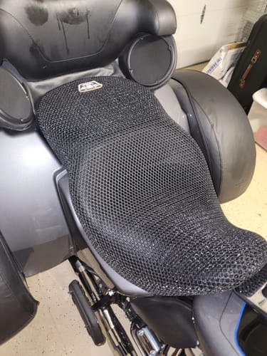 Customer's black mesh Wind Rider Seat Cover fitted onto a large motorcycle seat, seen from the side.