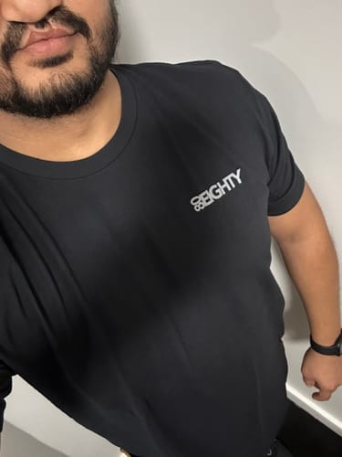 Close-up of a reviewer wearing the black 80Eighty Limited Edition DCG89 Shirt.