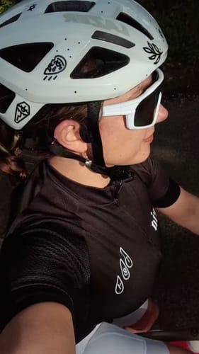 Customer wearing a white helmet decorated with small black Occult transfer decals.