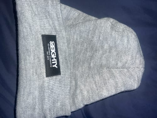 Customer's gray 80eighty GCS Beanie laid flat, showing a close-up of the black logo patch.