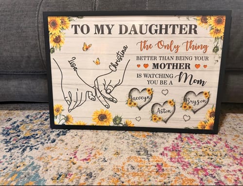 Customer's framed 'To My Daughter' personalized poster showing the sunflower and holding hands design with custom names.