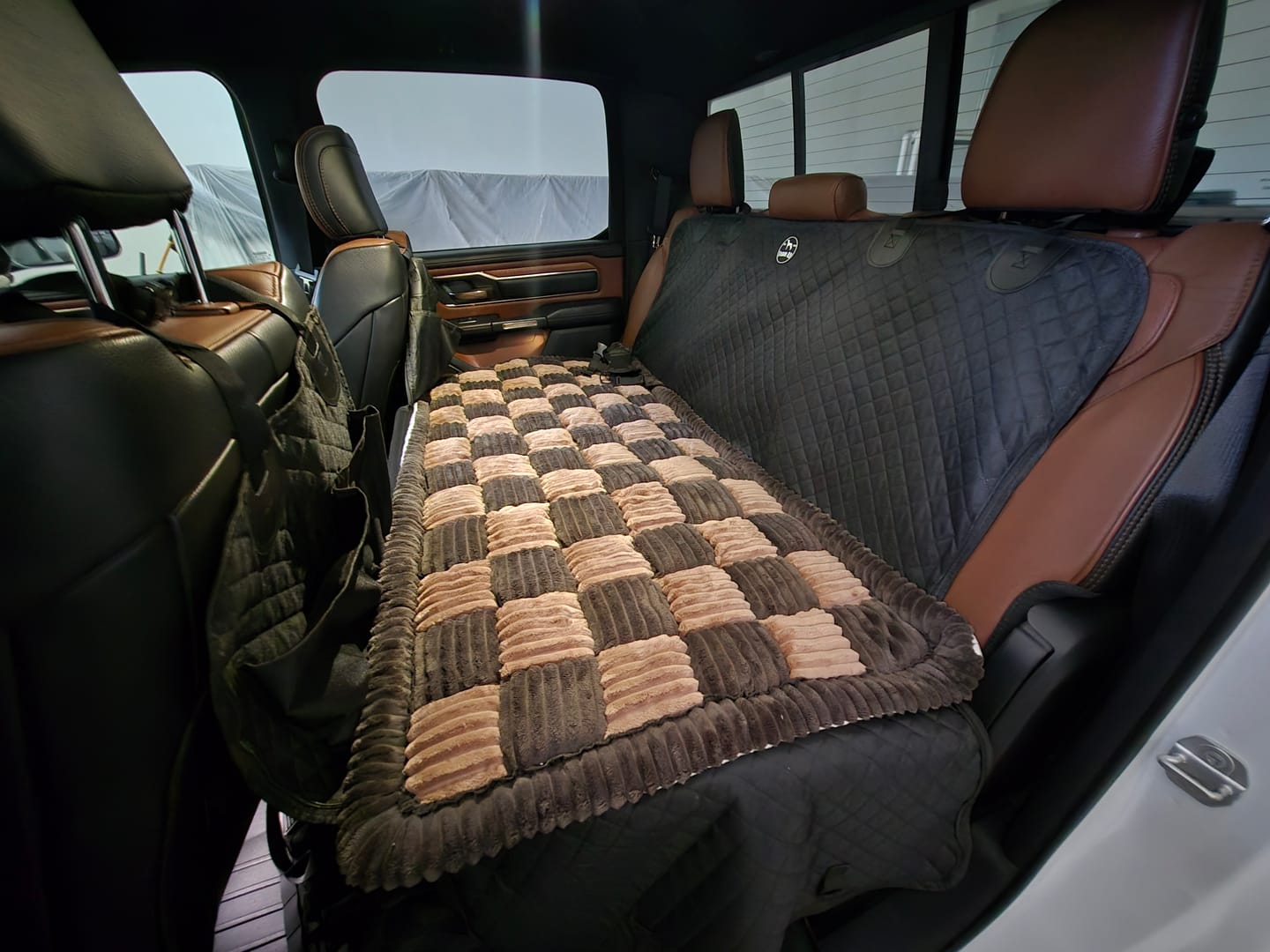 Customer photo review of NEW Waterproof Hard Bottom Car & Truck Seat Foldable Hammock Cover With Storage Pockets, Side Flaps, Headrest Straps, Seat Anchors, & Mesh Window (+FREE SAFETY BELT!)