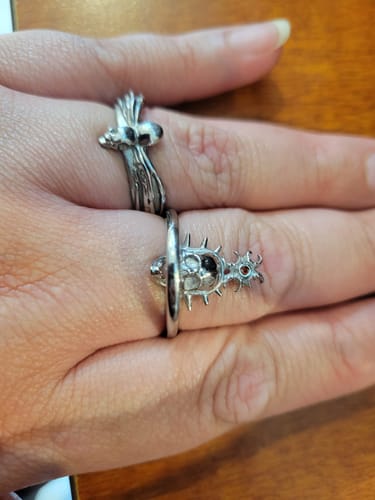 Customer's hand wearing the silver ORBITUARY RING, featuring its spiky orb design.