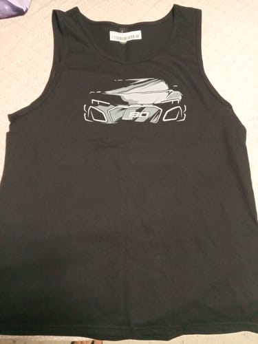 Customer's black 80Eighty DCG89 Tank with a large car graphic, laid flat.