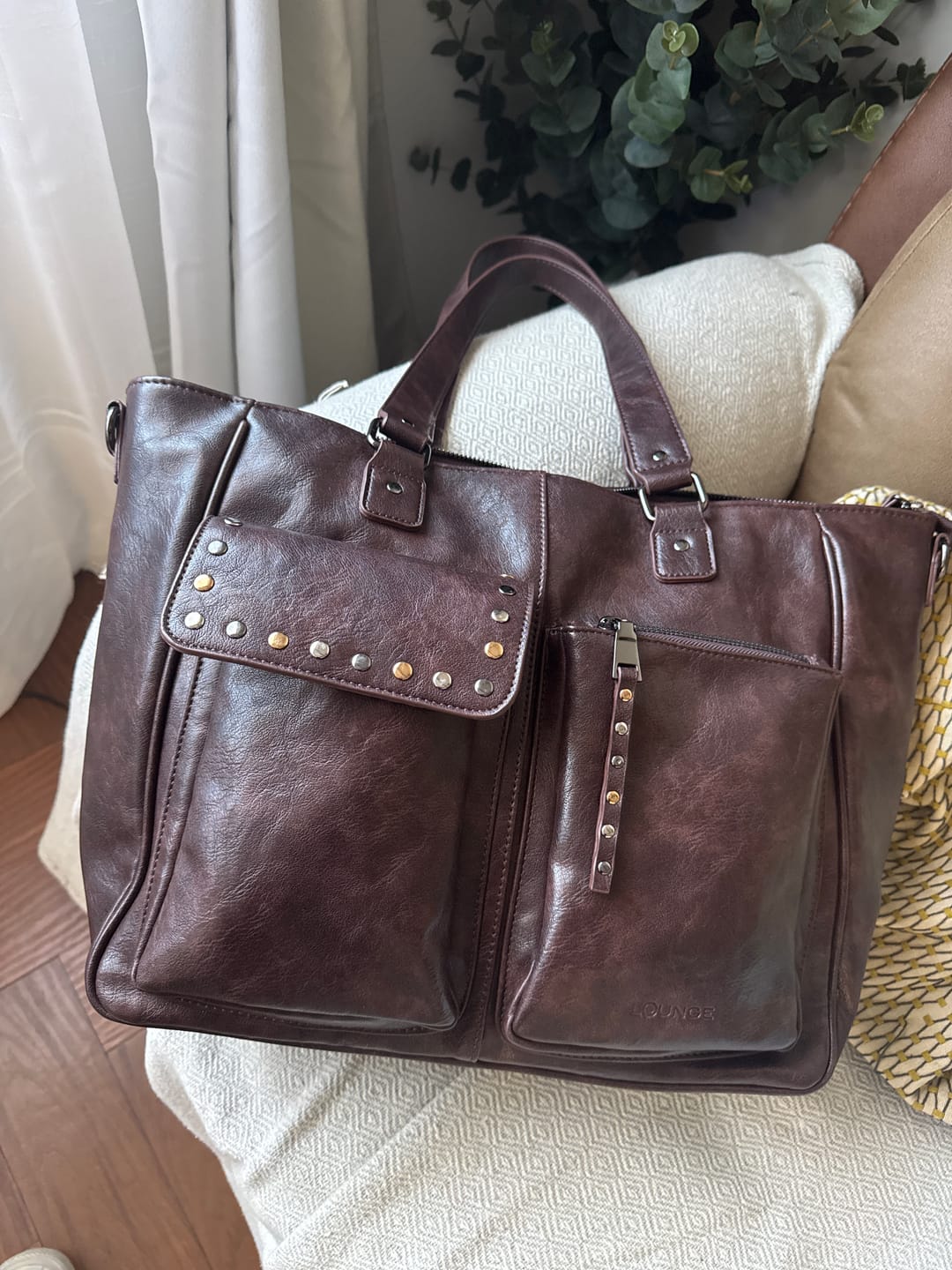 Customer photo review of Cartera Notebook Bolsillos Tachas