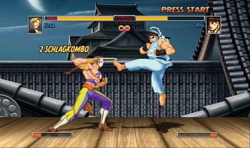 Rezensent zeigt den Street Fighter-Aufdruck auf seinem ONE LOVE T-Shirt.