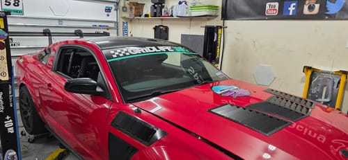 Customer's well-maintained red car, showing the results of towels cleaned with +Soap Microfiber Cleaner.