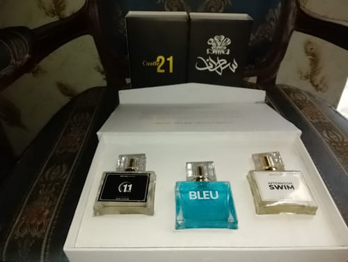 Customer's OUD Supreme BUNDLE showing three perfume bottles presented in a white box.